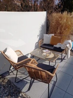 Lounge Set Rattan Natürlich 4-Sitzer Auflagen Schwarz MINORI -Beliani Verkaufsgeschäft undef src sa picid 821329 type whitesh image